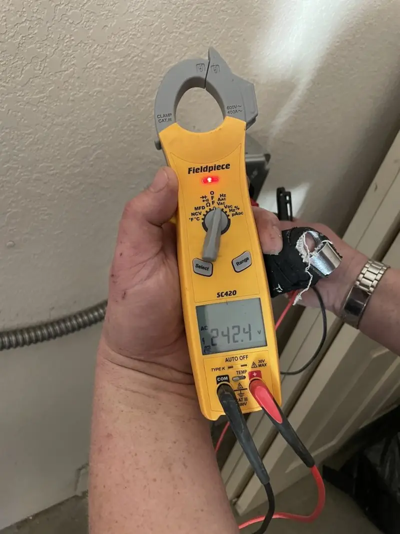 Voltage testing with clamp meter during Outlet Installation in Frankfort Square